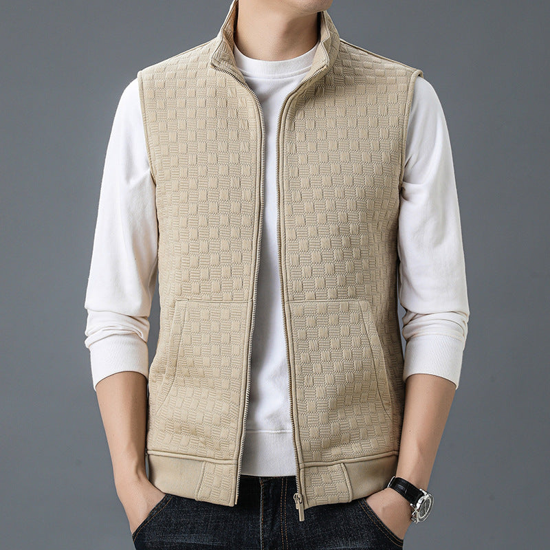Beige casual sleeveless top waistcoat with zipper and textured pattern, worn over a white long-sleeve shirt.