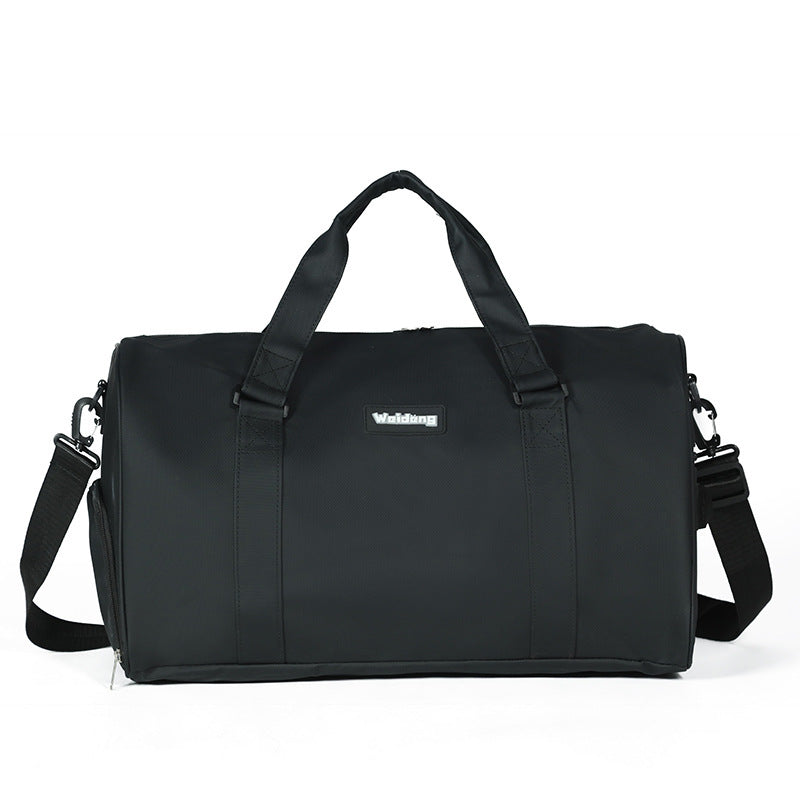 Portable female large capacity black swimming bag with adjustable shoulder strap and dual handles made of durable Oxford cloth.