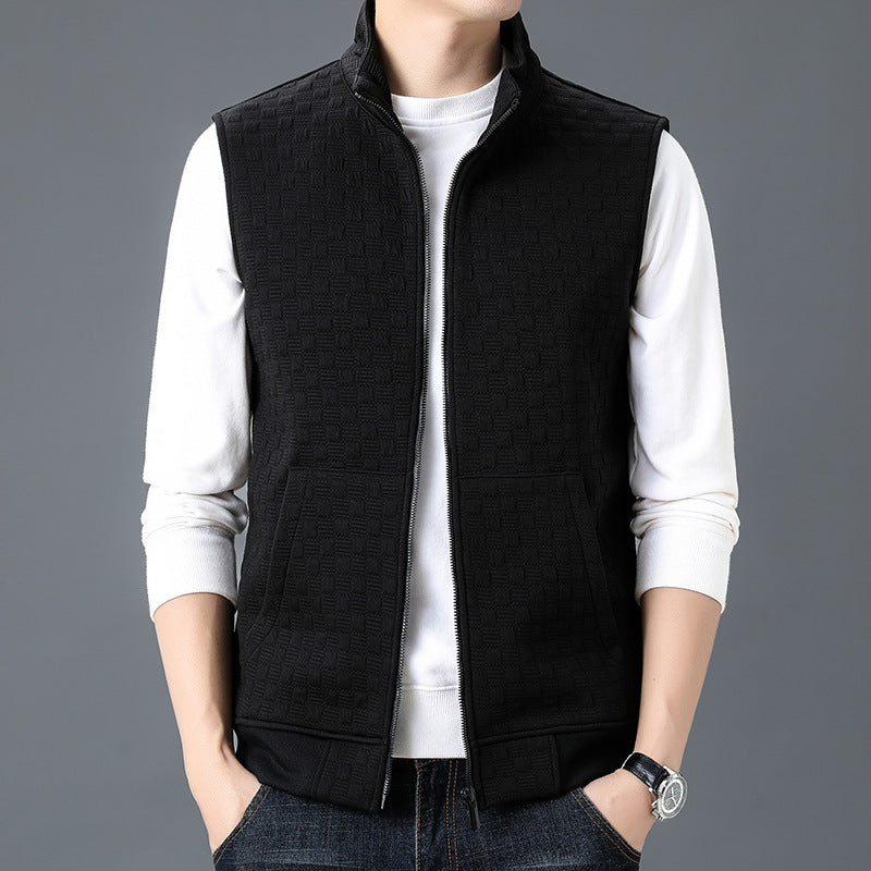 Black casual sleeveless top waistcoat vest with zipper front and pockets worn over long sleeve white shirt