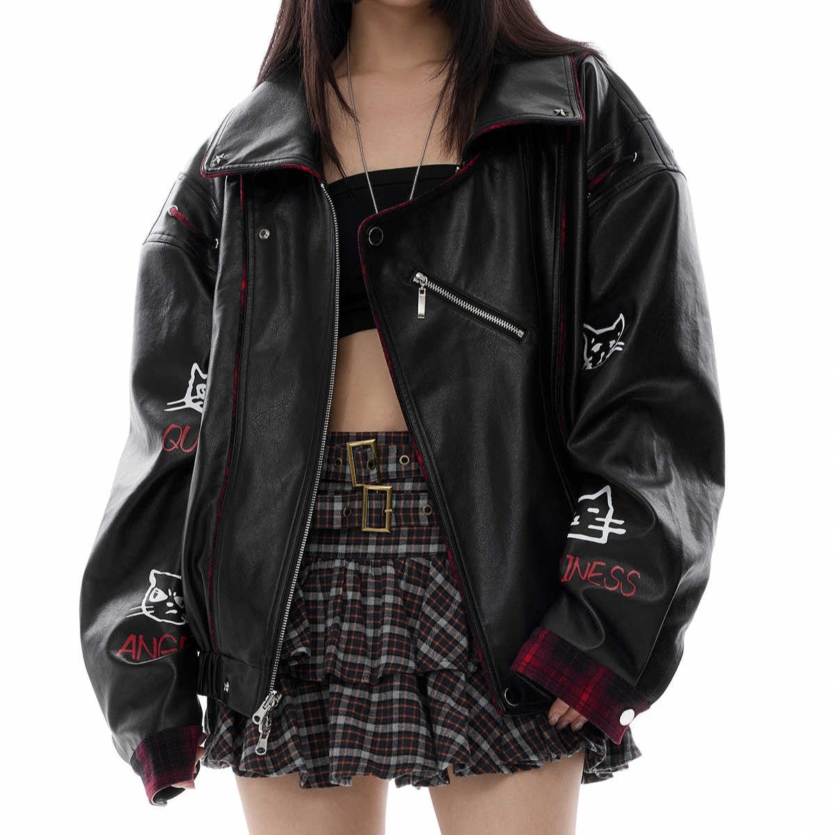 Black PU leather motorcycle reversible jacket with red plaid lining and graphic embroidery on sleeves worn by model
