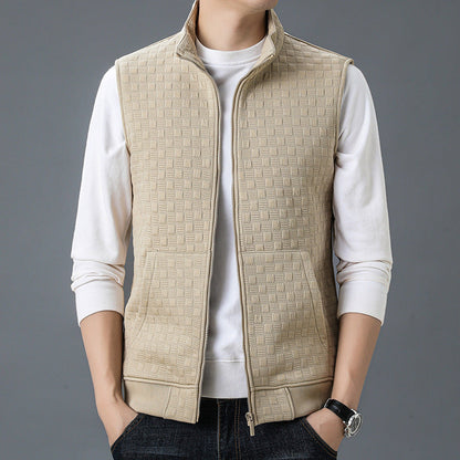 Beige casual sleeveless top waistcoat with zipper and textured pattern, worn over a white long-sleeve shirt.