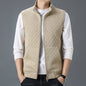 Beige casual sleeveless top waistcoat with zipper and textured pattern, worn over a white long-sleeve shirt.