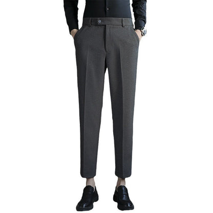 Straight retro brown slim fit casual pants with elastic waist, made from corduroy polyester fabric.