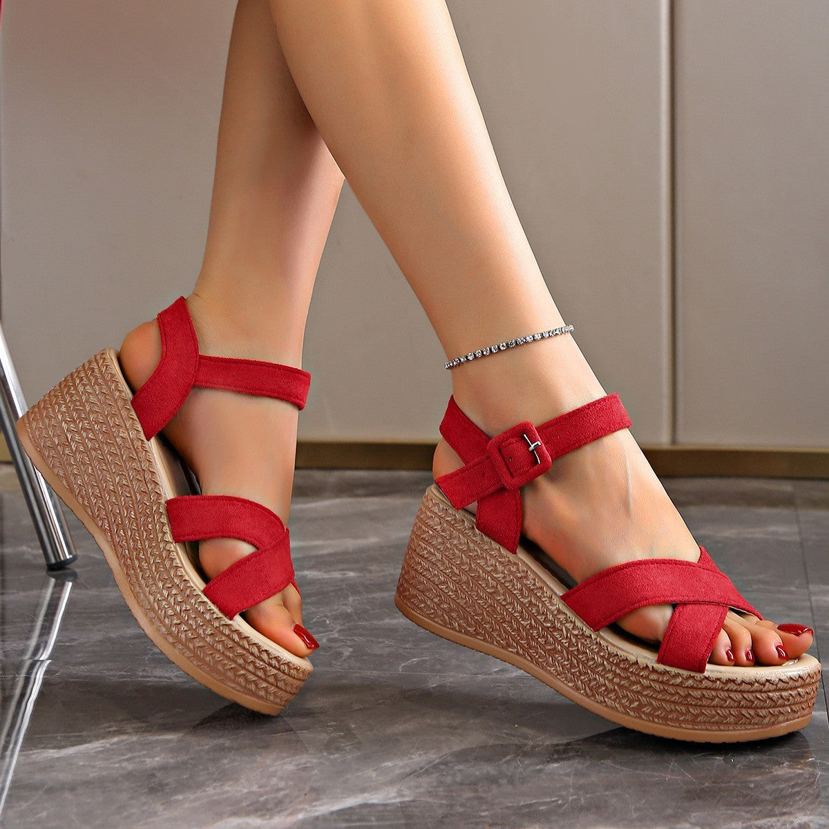 Red women's platform suede sandals with buckle straps and woven textured sole