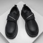 Black casual new platform leather shoes for men with low top design and zipper strap closure.