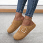 Women's closed toe low top canvas slippers in brown with buckle detail worn with jeans on carpeted floor
