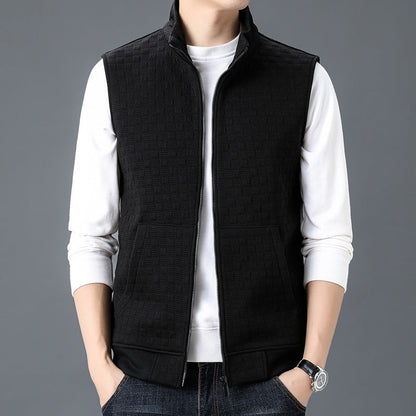 Black casual sleeveless top waistcoat vest with zipper front and pockets, worn over white long sleeve shirt