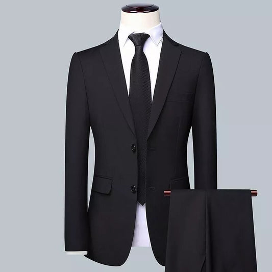 Black slim fit men's business suit set with jacket, trousers, and tie on mannequin