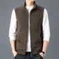 Brown casual sleeveless top waistcoat vest with zipper and textured fabric worn over white long sleeve shirt