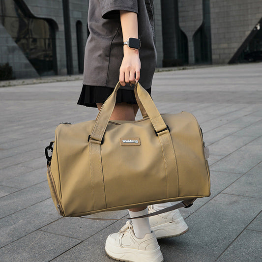 portable female large capacity swimming bag in brown oxford cloth carried by woman outdoors
