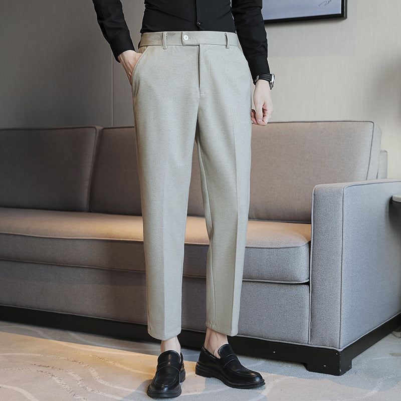 Slim fit straight retro brown casual pants in corduroy fabric with elastic waist, styled for light business wear.