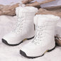 White cotton-padded waterproof snow boots with non-slip rubber soles and artificial fur lining for cold weather outdoor use